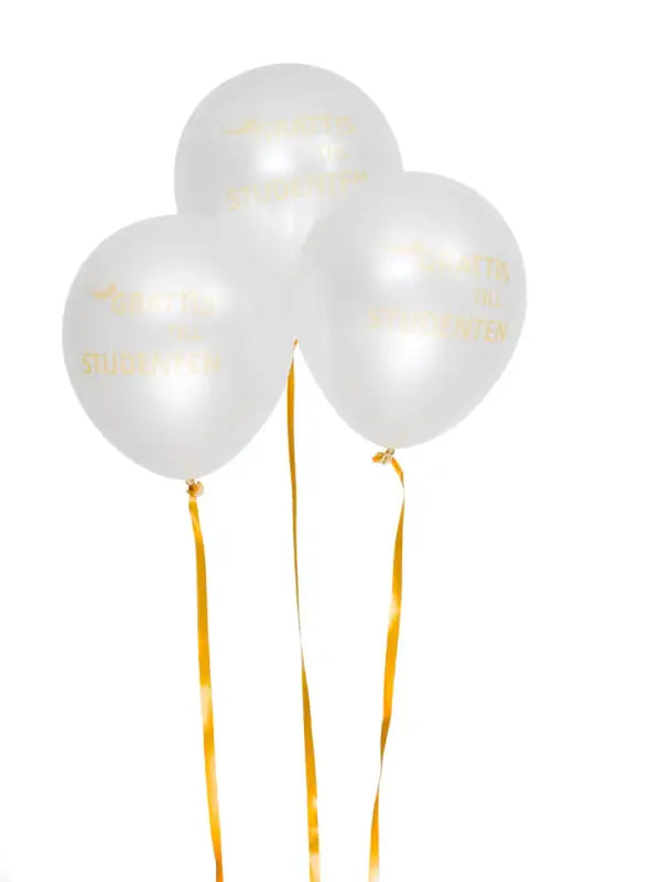 Tre vita ballonger med guldband.