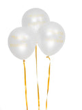 Tre vita ballonger med guldband.
